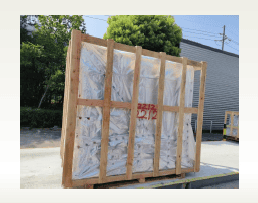 Heavy-duty wooden crate with protective plastic wrapping, ideal for secure wood product transportation.