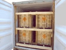 Stacked wooden crates in a warehouse for timber export.